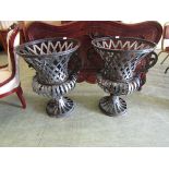 A pair of reproduction metalwork garden planters
