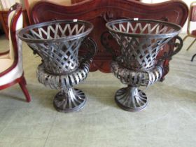 A pair of reproduction metalwork garden planters