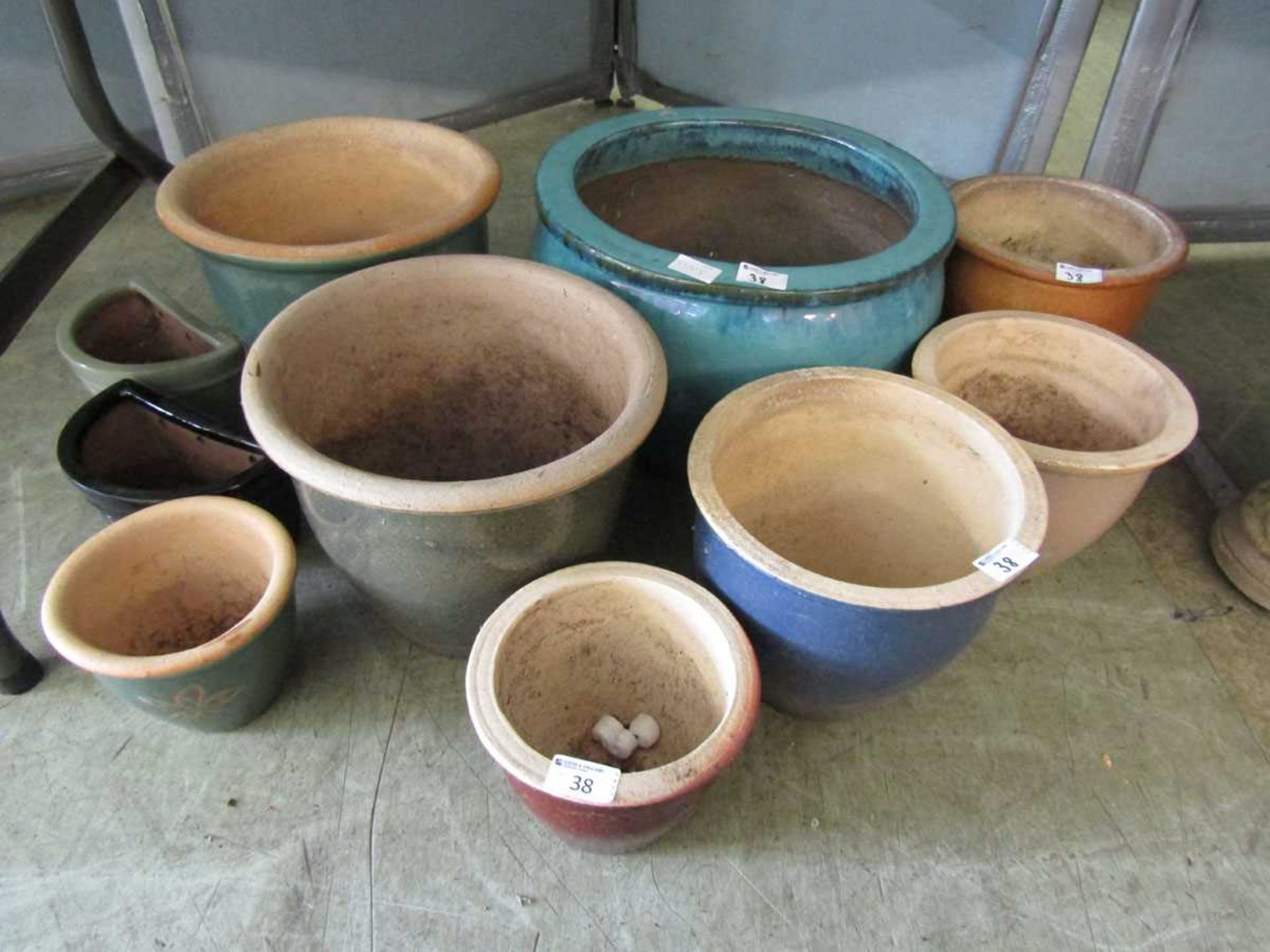 A selection of ten glazed garden pots