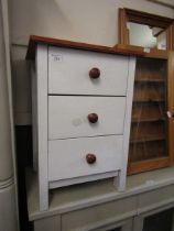 A modern cream painted pine chest of three drawers