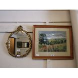 An ornate gilt framed wall mirror together with a framed and glazed print of countryside scene