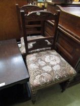 A pair of Edwardian walnut framed carved back dining chairs with overstuffed seat