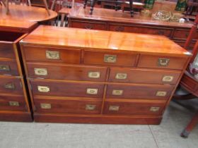 A reproduction campaign style yew cabinet having half lift up lid with dummy drawer doors below