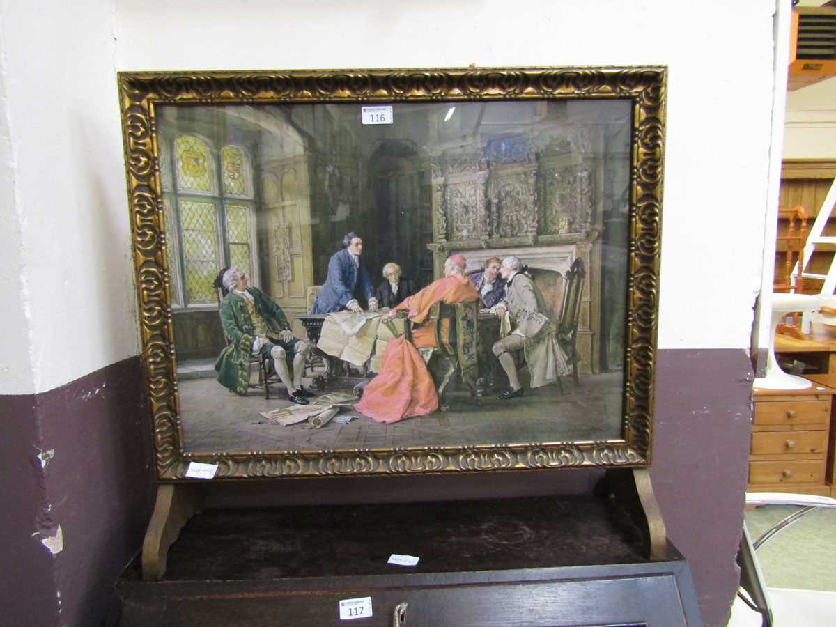 A gilt framed firescreen having a 17th century interior scene under glass