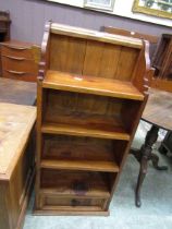 A waxed pine bookcase with drawer to base