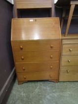 A mid-20th century teak fall front bureau