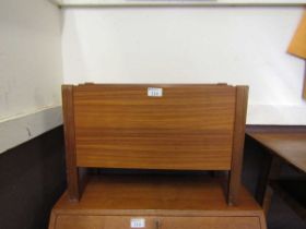 A mid-20th century teak magazine rack