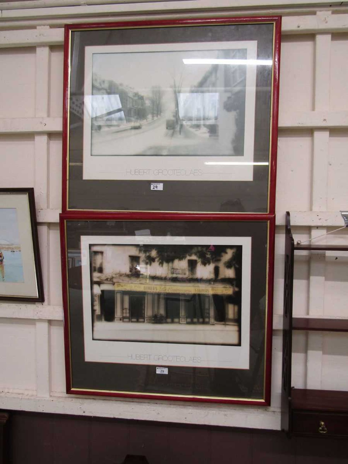 Two framed and glazed reproduction prints after Herbert Grooteclaus of street scenes