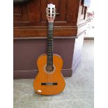 An acoustic guitar by Hohner
