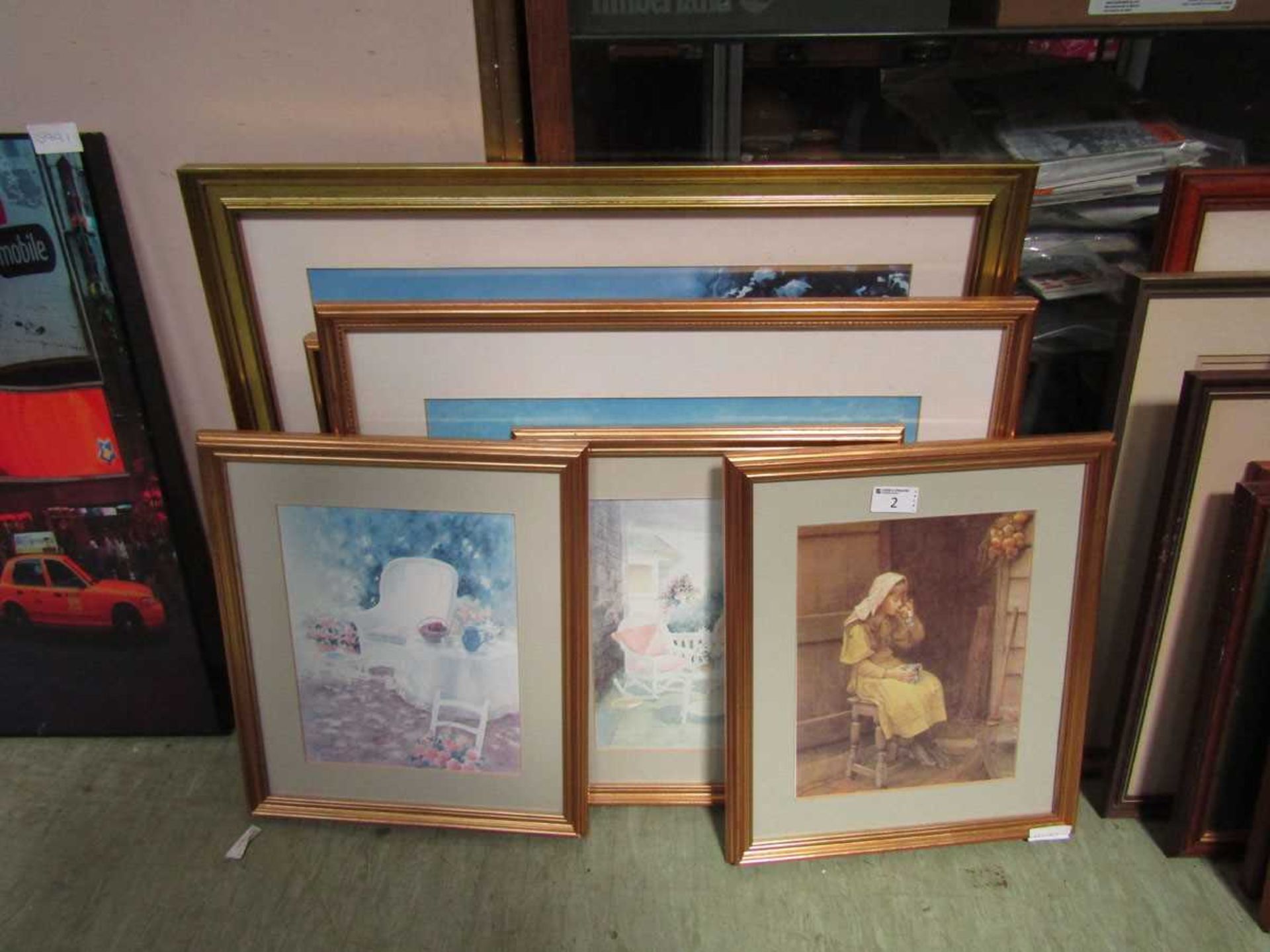 A selection of framed artworks on various subjects to include interior scenes, boating scenes, young