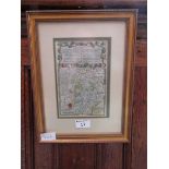 A framed and glazed coloured map of Warwickshire