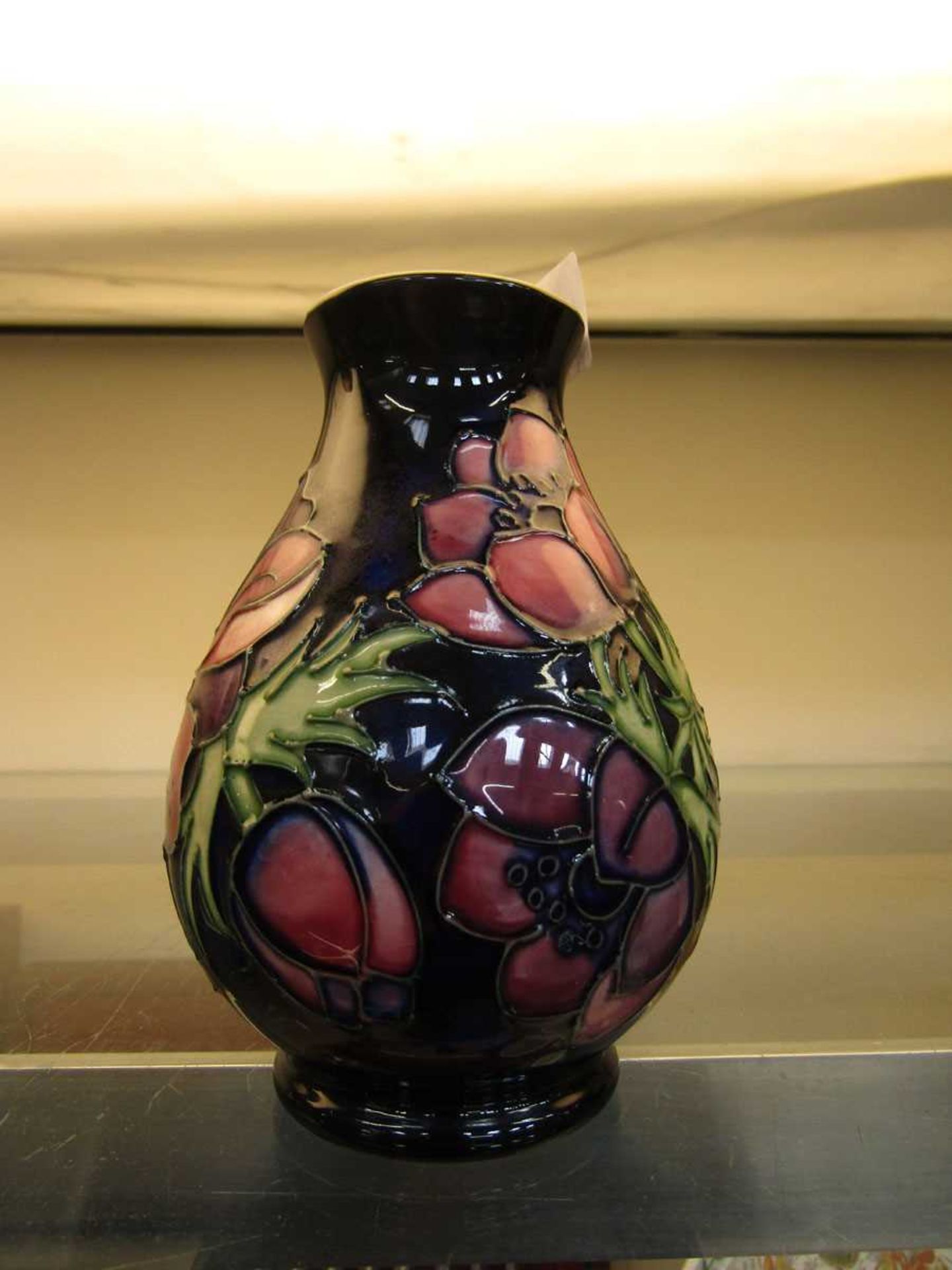 A blue ground Anemone pattern Moorcroft bud vase