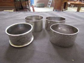 Four silver hallmarked napkin rings, approx. weight 115g