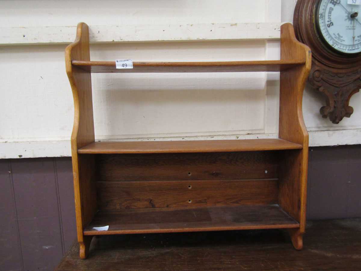 A mid-20th century oak wall mounted bookcase