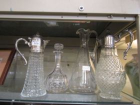 Four items of glassware to include decanter, water jugs, etc
