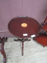 A reproduction mahogany pedestal wine table