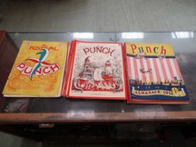 A PVC bag containing a large assortment of mid-20th century Punch annuals