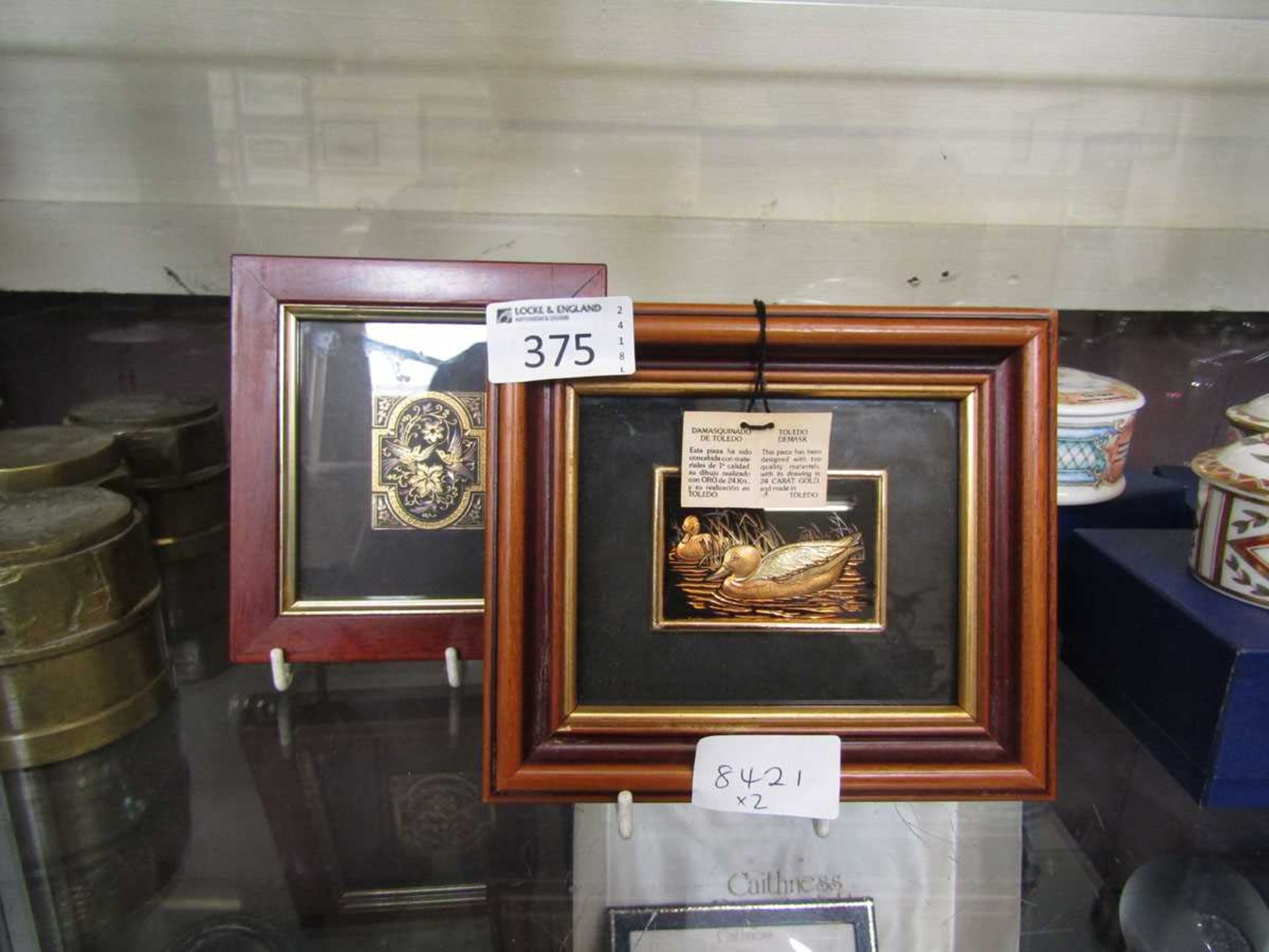 A framed and glazed Toledo 24ct gold artwork of ducks along with one other framed and glazed gilt