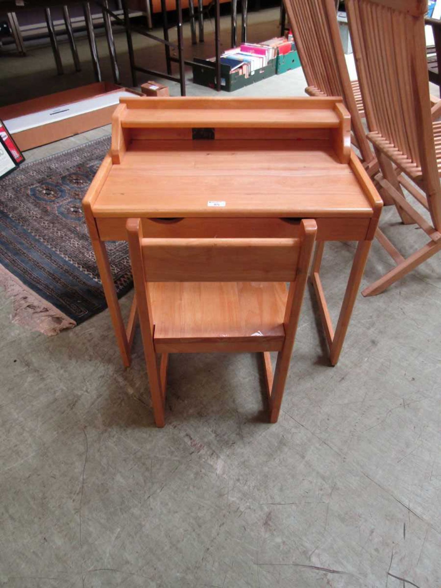 A modern child's desk with matching chair