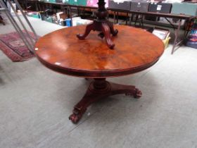 A Victorian walnut tilt top table