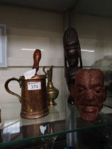 An assortment of five items to include African carved model of a lady, engraved brass jug, brass and