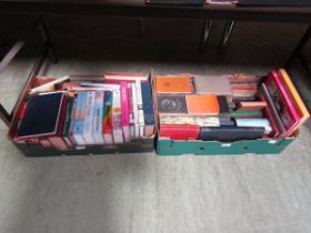 Two trays of hardback books by various authors