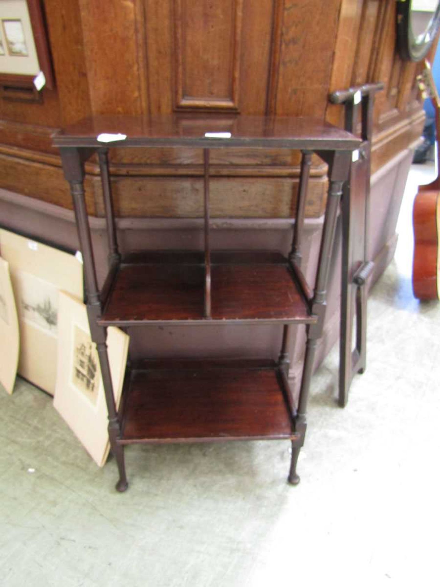A Georgian mahogany stand having open storage to under