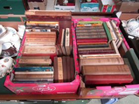 Two trays of hard back books relating mainly to carpentry