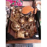 A tray containing a quantity of brass items to include kettle, trivets, candlesticks, etc