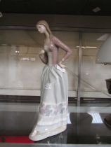 A large Lladro figurine of elegant lady (A/F)