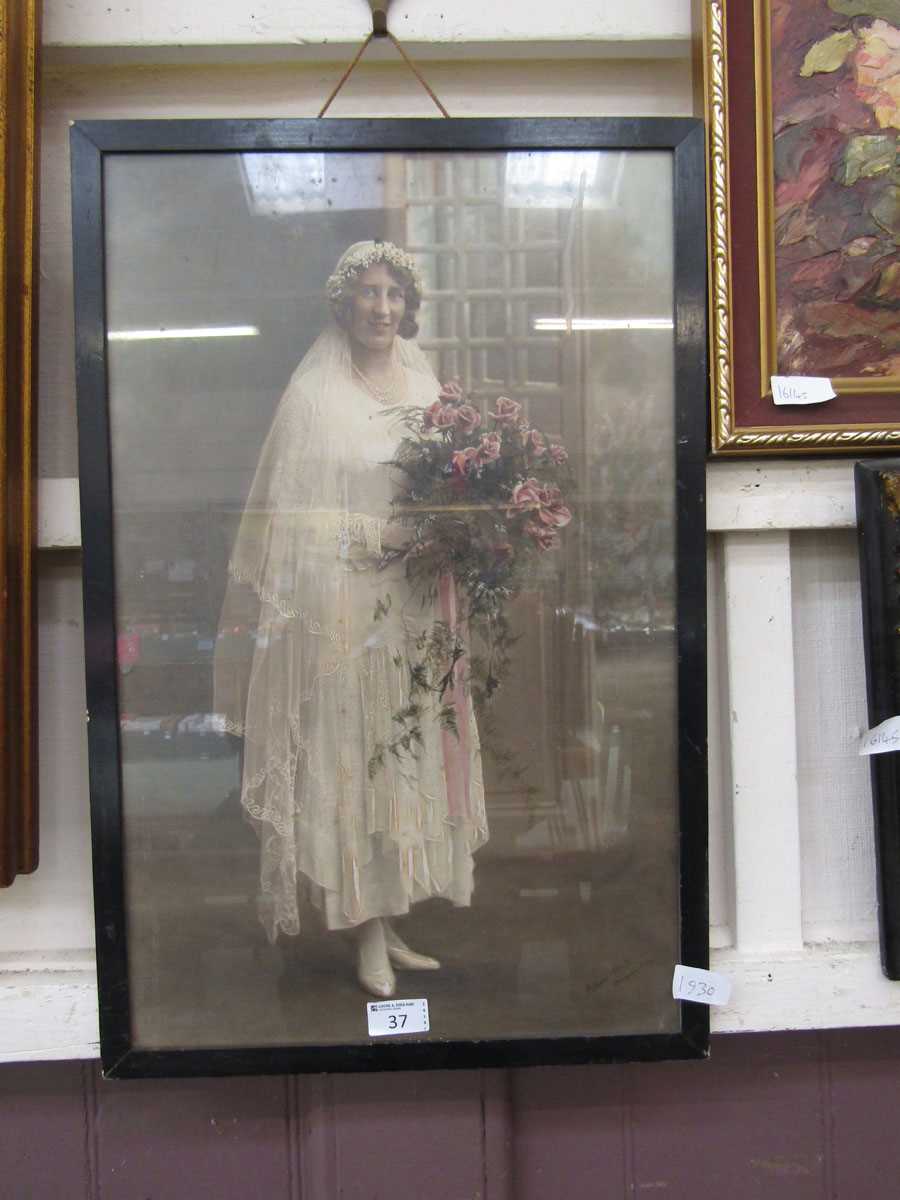 An early 20th century framed and glazed photograph of bride