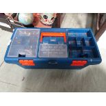 A blue toolbox containing an assortment of hand tools