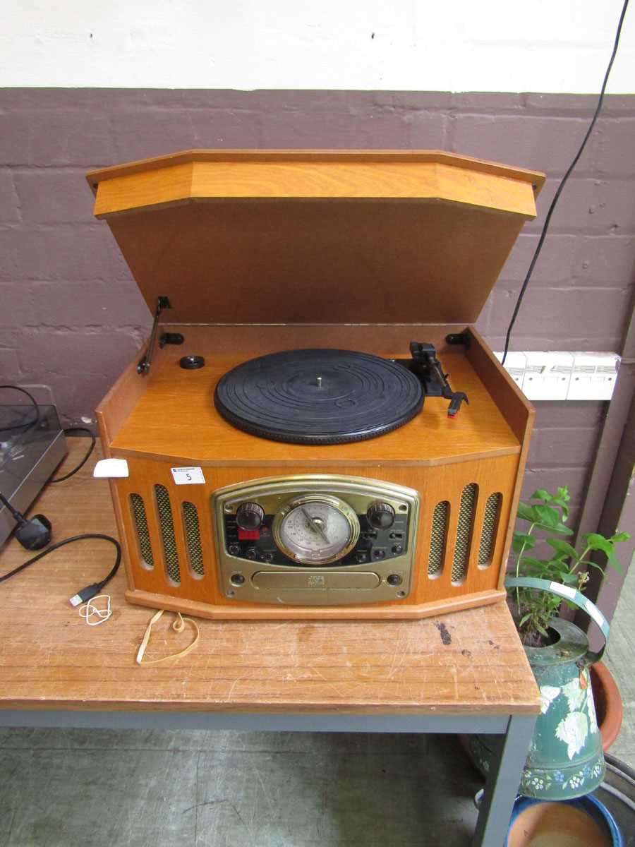 A reproduction oak cased art deco style music centre comprising of turntable, tuner, and CD player