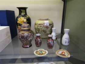 An assortment of nine pieces of oriental ceramic are to include Satsuma style bud vases, Japanese