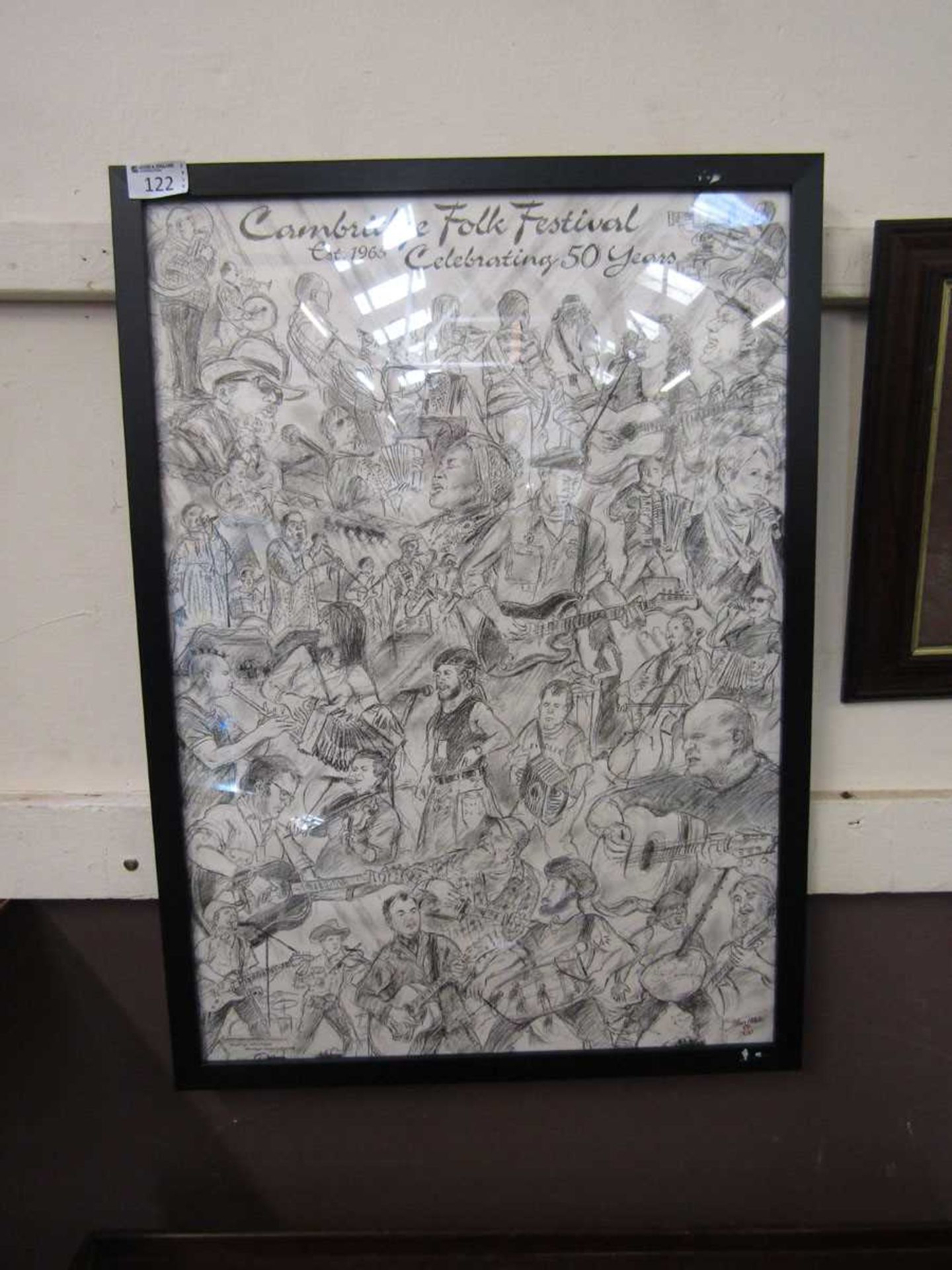 A framed and glazed print 'Cambridge Folk Festival Celebrating 50 Years'