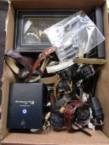 A carton containing a large quantity of used wristwatches by various makers