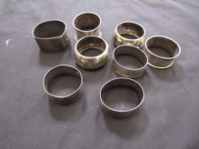 A bag containing eight silver hallmarked napkin rings, approx. weight 140g