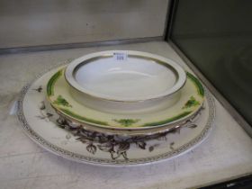 Four meat plates by various makers to include Woods, along with a Royal Doulton 'Clarendon' bowl