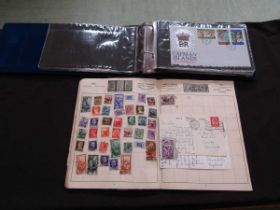 An album of first day covers together with an album of various other stamps from around the world