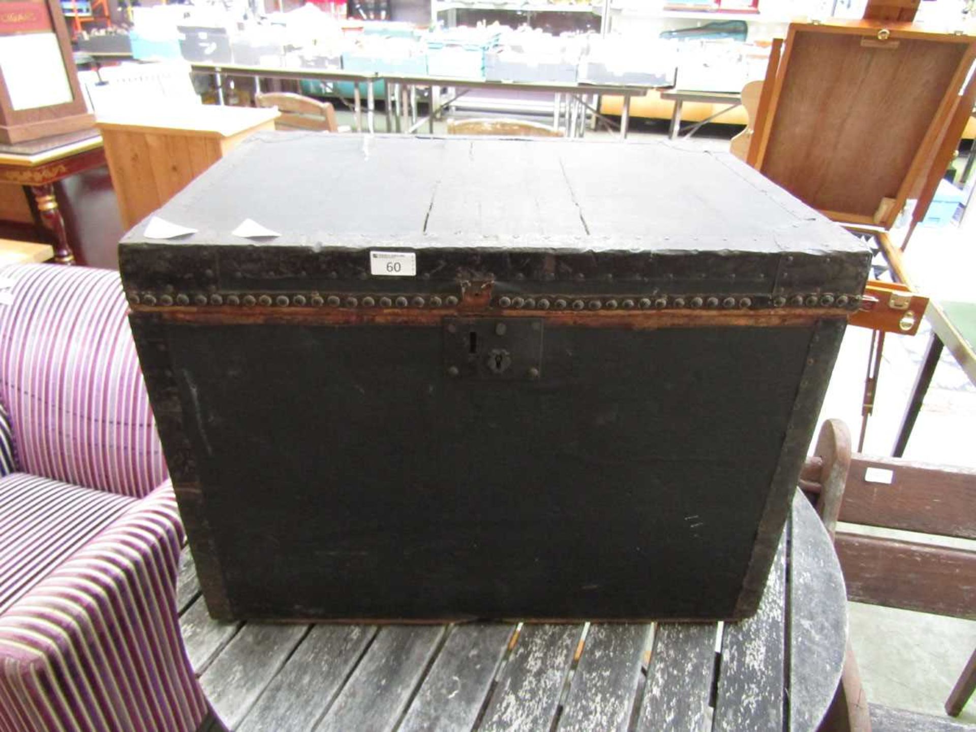 A 19th century oil skin and metalwork travelling trunk by retailer Henry Pound and Sons