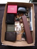 A box containing a quantity of costume jewellery to include necklaces, cuff links, rings, etc