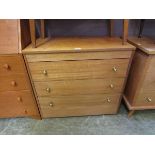 A mid-20th century four drawer chest of drawers