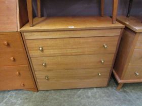 A mid-20th century four drawer chest of drawers