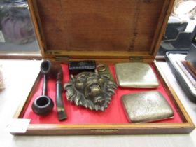 A wooden box containing plated cigarette cases, snuff box, pipes, etc