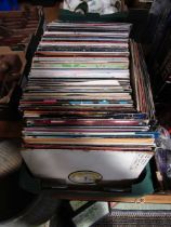 A tray containing LPs and approximately thirty five laser discs by various artists to include Nick