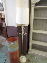 A reproduction white metal painted standard lamp with shade