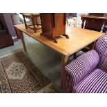 A late 20th century maple effect topped rectangular dining table