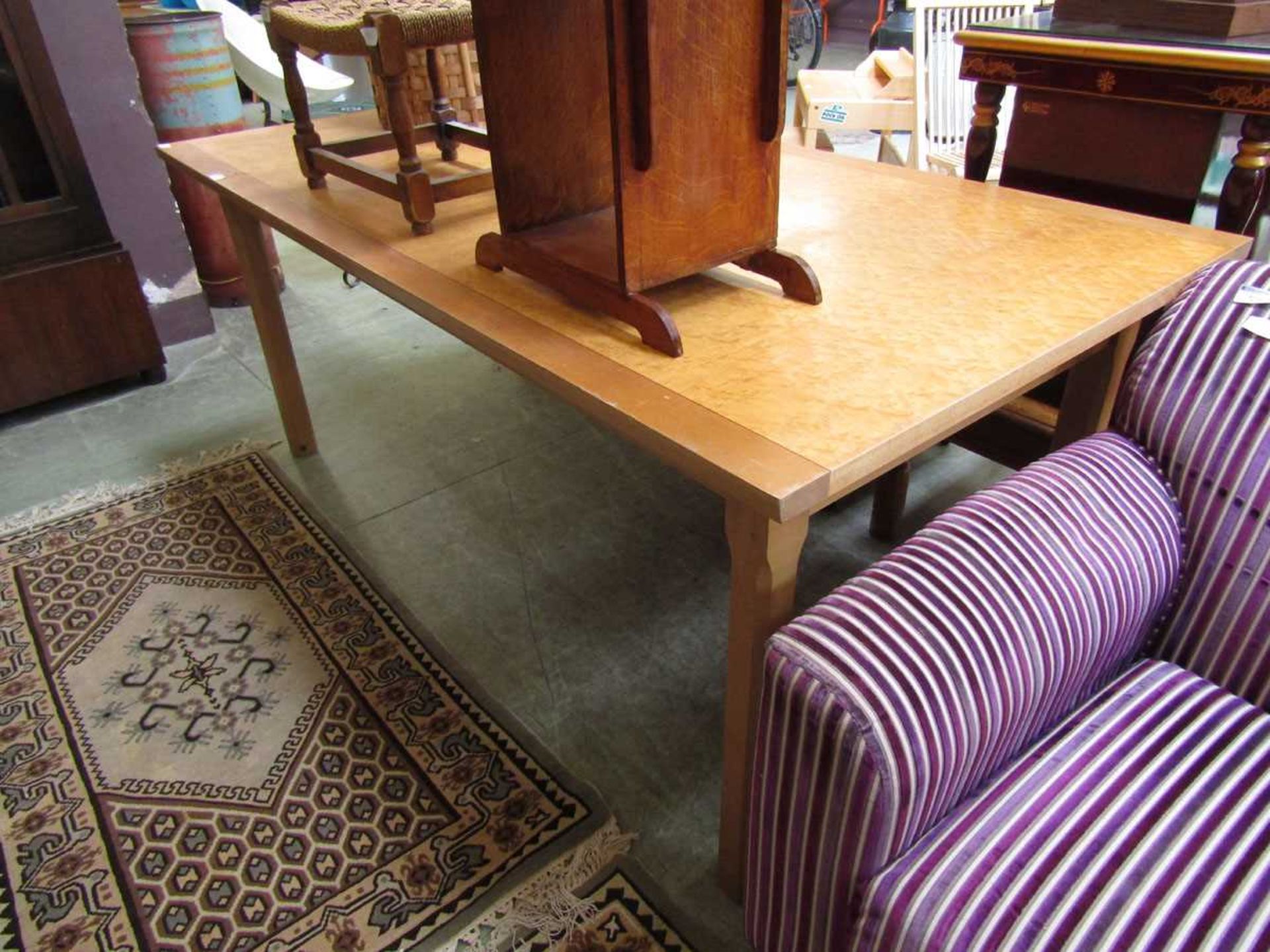 A late 20th century maple effect topped rectangular dining table