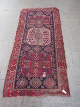 A red ground rug (A/F)