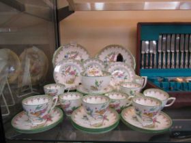 A selection of Minton 'The Ho Ho Bird' ceramic tableware consisting of cups, saucers, cake plates,